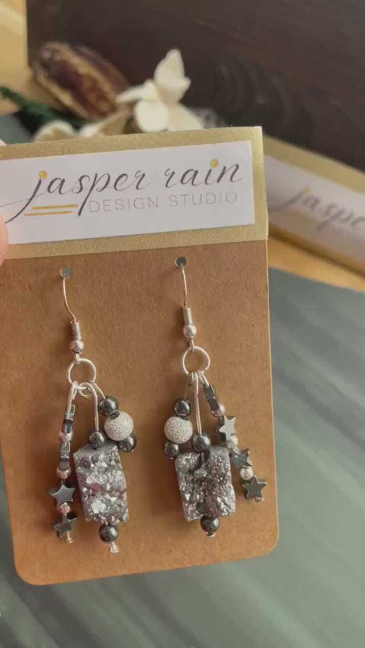 Platinum Druzy crystal, silver glitter beads, and hematite star beads. Handmade, one-of-a-kind dangle earrings