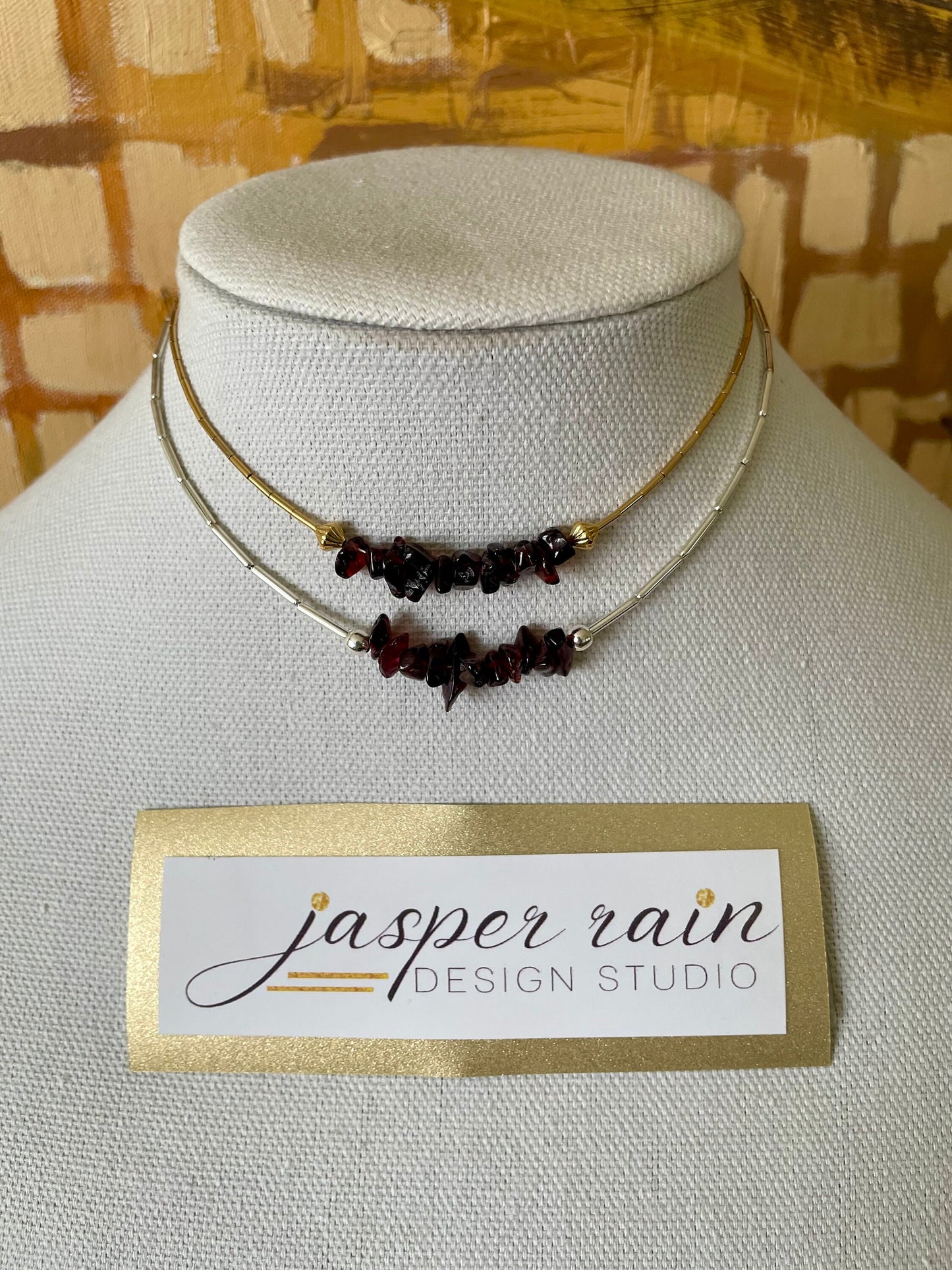 Garnet and gold or silver collarbone-length necklaces. Simple & Elegant