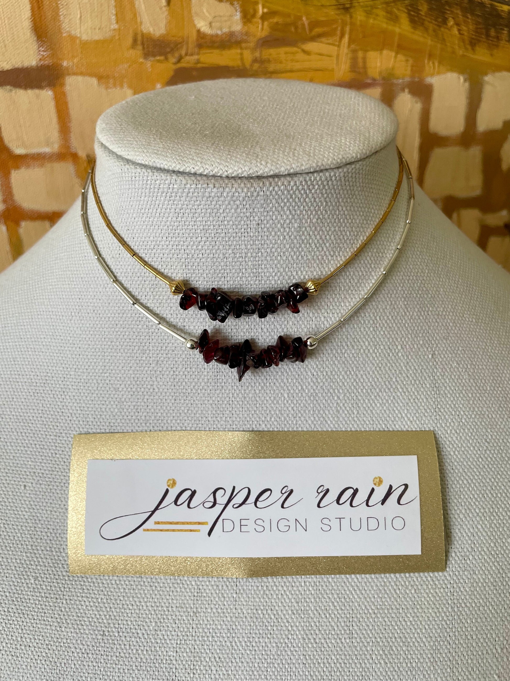 Garnet and gold or silver collarbone-length necklaces. Simple & Elegant