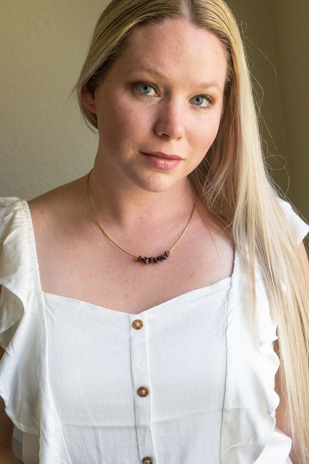 Garnet and gold or silver collarbone-length necklaces. Simple & Elegant
