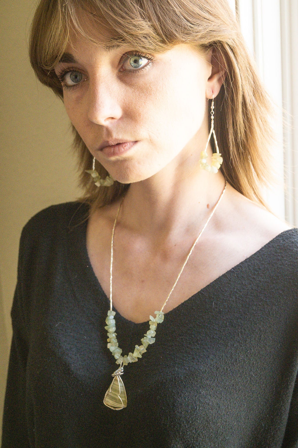 Gemstone drop earrings with prehnite chips and stainless steel beads.