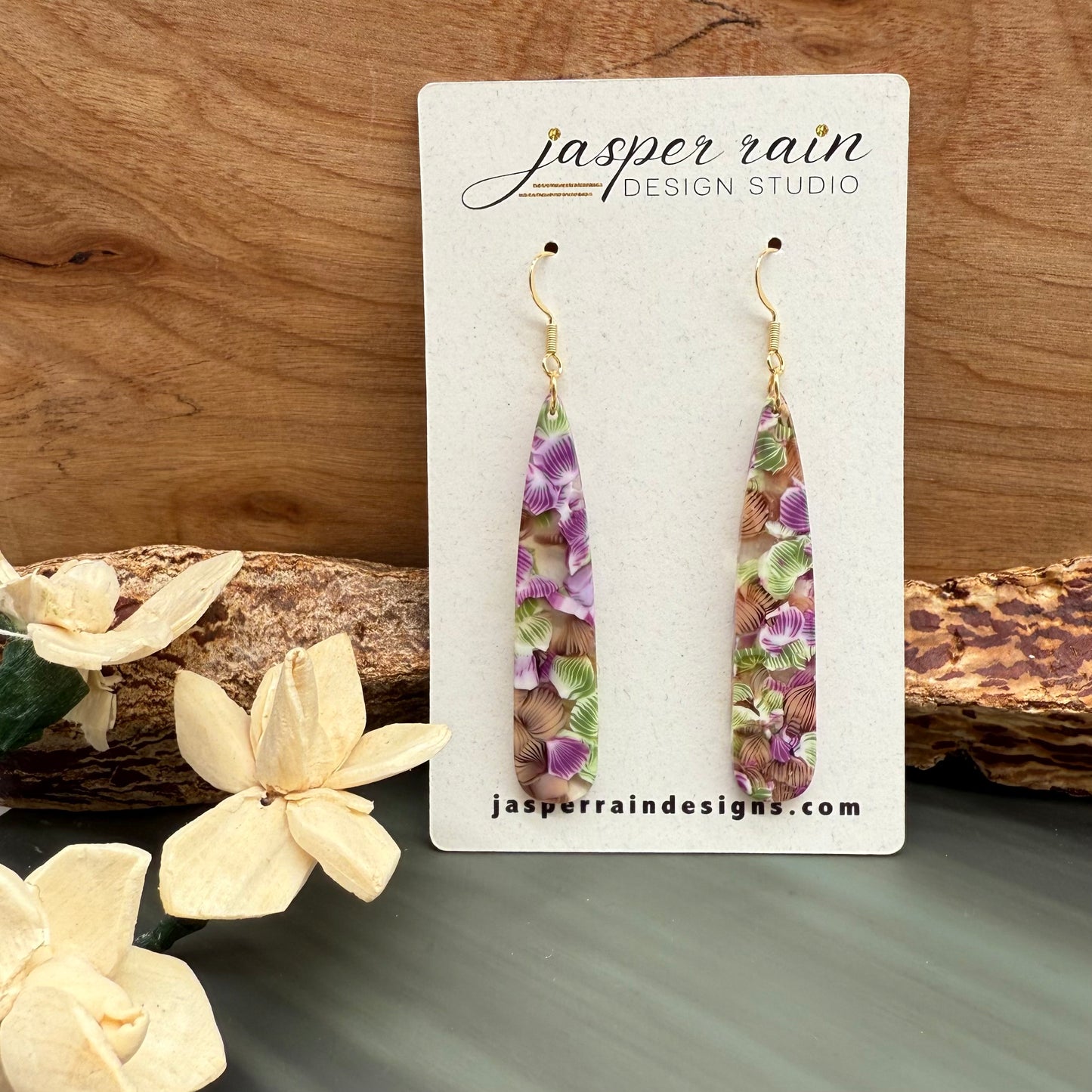 Purple and green flowers in resin long dangle earrings