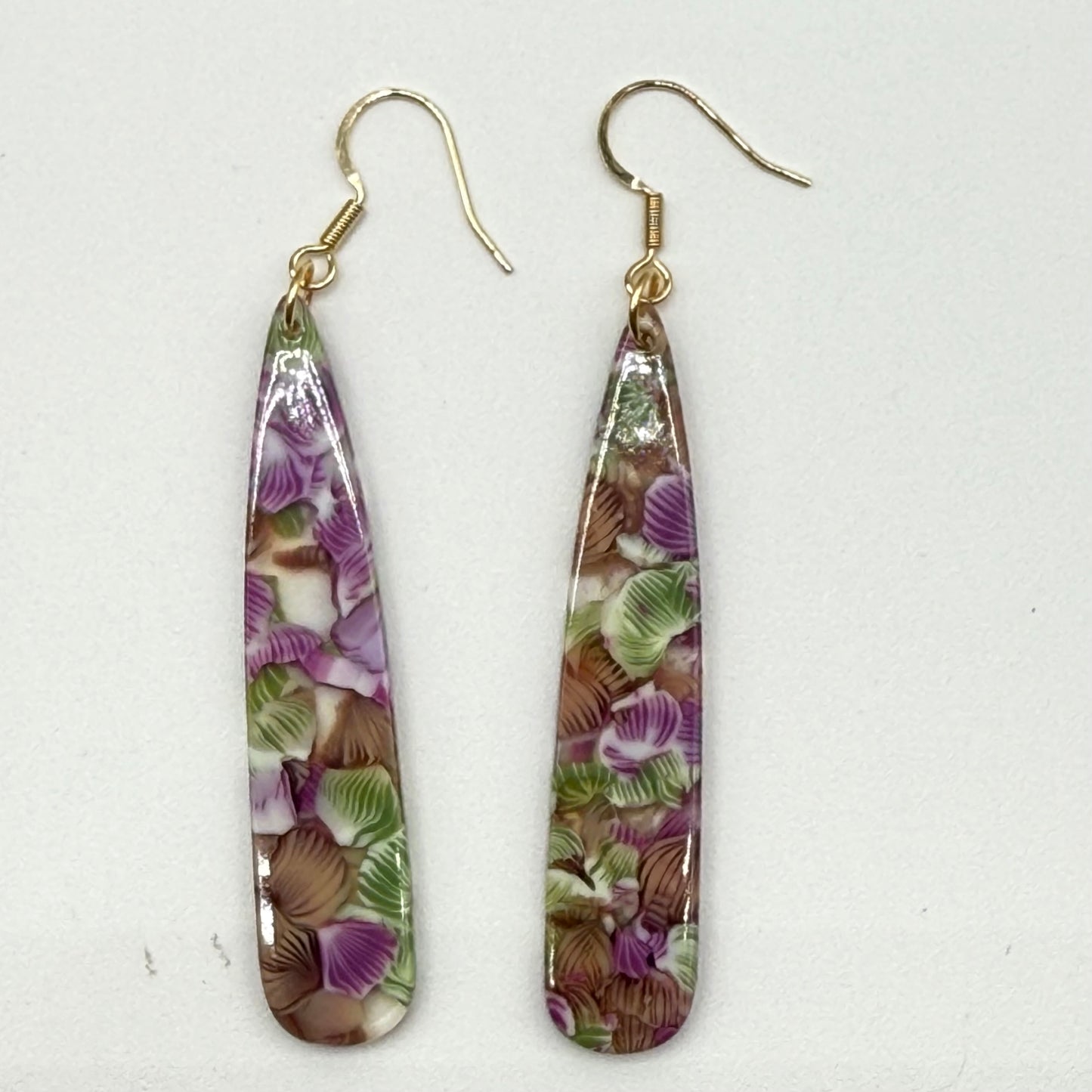 Purple and green flowers in resin long dangle earrings