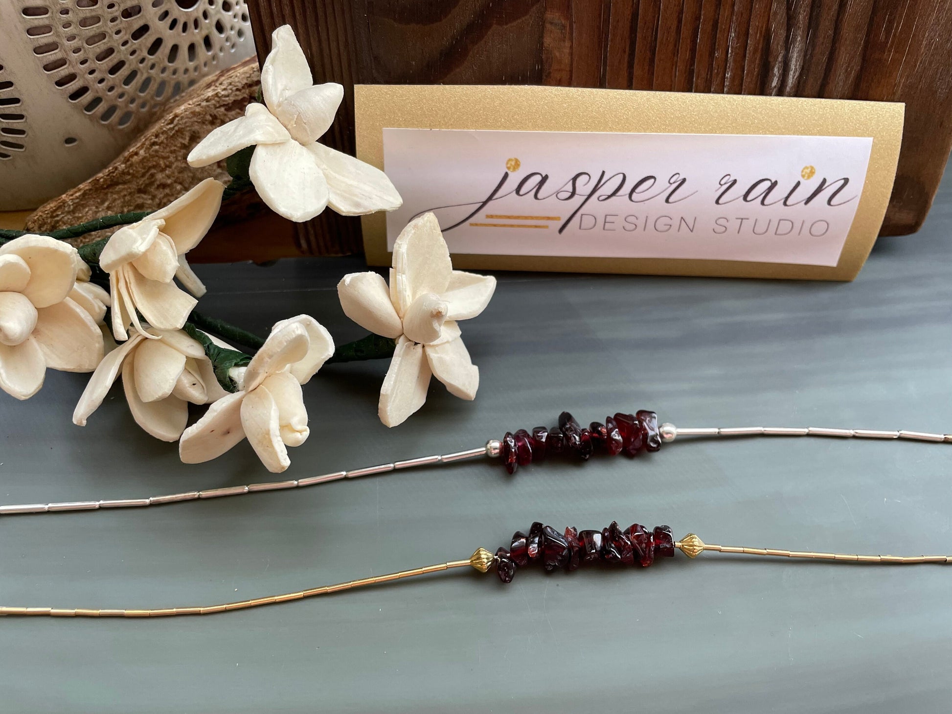 Garnet and gold or silver collarbone-length necklaces. Simple & Elegant